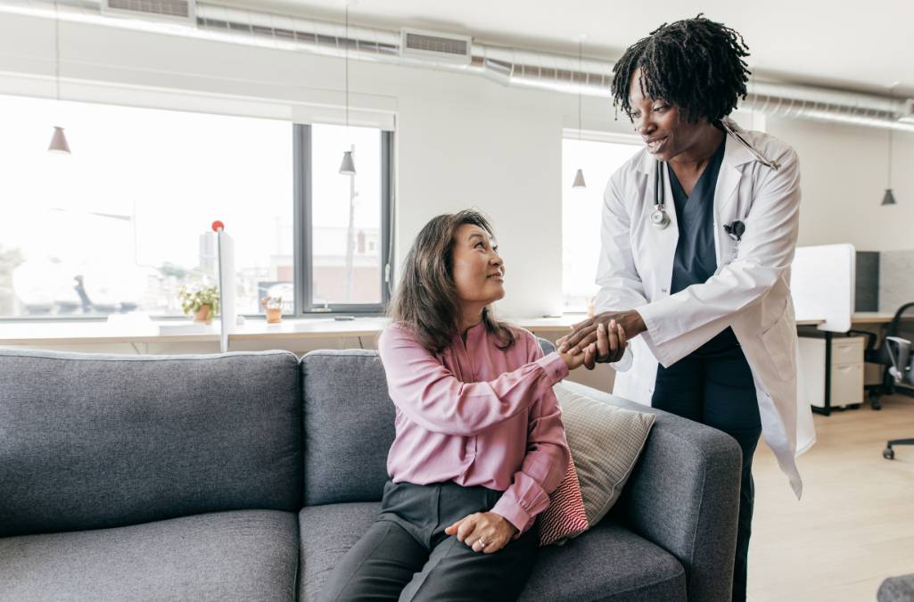 Older woman receiving care from a healthcare practioner